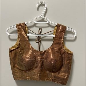 Golden sleeveless universal blouse for sari / lengha